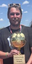 Zach holding the City Tournament Unified Soccer Trophy for the second year in a row. 
