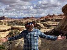 Standing among the red rock landscape of Canyonlands National Park in Utah.